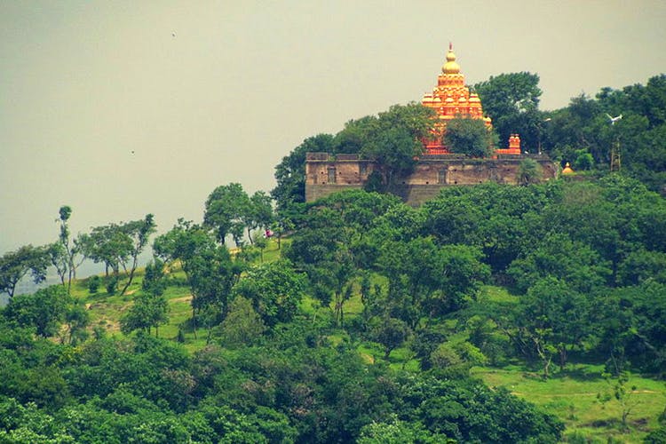 Vegetation,Hill station,Pagoda,Landmark,Sky,Historic site,Temple,Tower,Tree,Place of worship