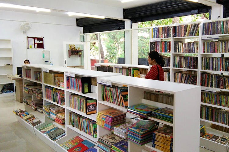 Library,Public library,Bookcase,Shelving,Shelf,Bookselling,Building,Book,Publication,Retail