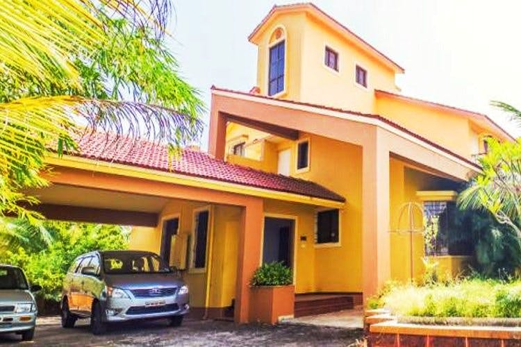 Property,Home,House,Building,Real estate,Yellow,Residential area,Car,Vehicle,Facade