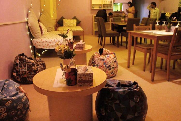 Furniture,Table,Room,Interior design,Chair,Restaurant,Lighting accessory,Living room