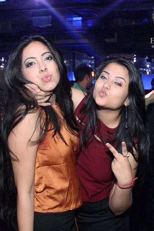 Lady,Nightclub,Friendship,Fun,Black hair,Event,Long hair,Flash photography,Fawn