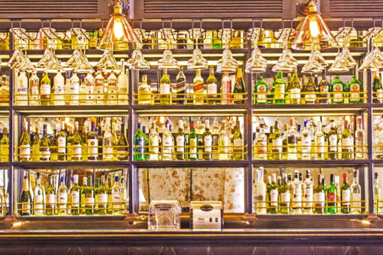 Alcohol,Liqueur,Glass bottle,Distilled beverage,Bar,Bottle,Building,Whisky,Blended whiskey,Drink