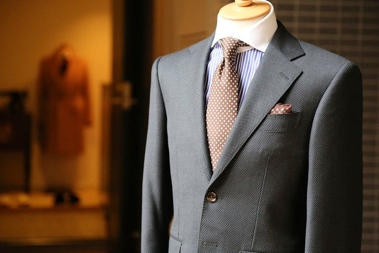 raymond suit stitching price