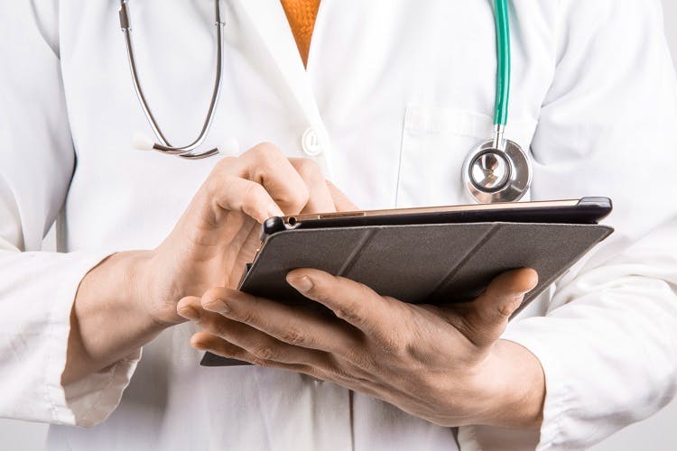 Stethoscope,Skin,Hand,Physician,Gadget,Technology,Electronic device,Photography,Fashion accessory,Tablet computer