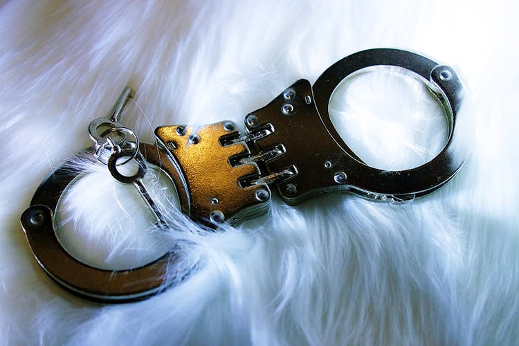 Handcuffs,Fashion accessory,Photography,Still life photography,Personal protective equipment,Metal,Silver