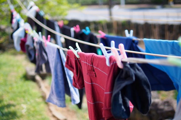 Laundry,Clothing,Pink,Textile,Sportswear,Grass,T-shirt,Undergarment,Leisure