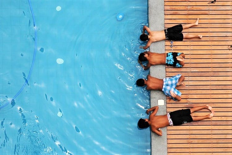 Blue,Water,Leisure,Swimming pool,Vacation,Fun,Recreation,Swimming,Sun tanning