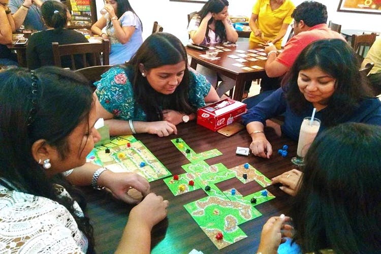 Games,Indoor games and sports,Tabletop game,Community,Recreation,Leisure,Fun,Play,Board game,Table