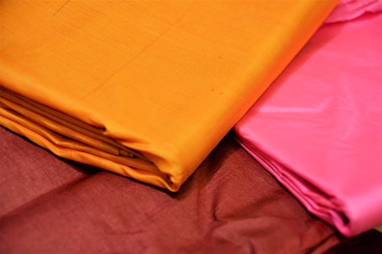 Red,Yellow,Orange,Bed sheet,Textile,Linens,Leather
