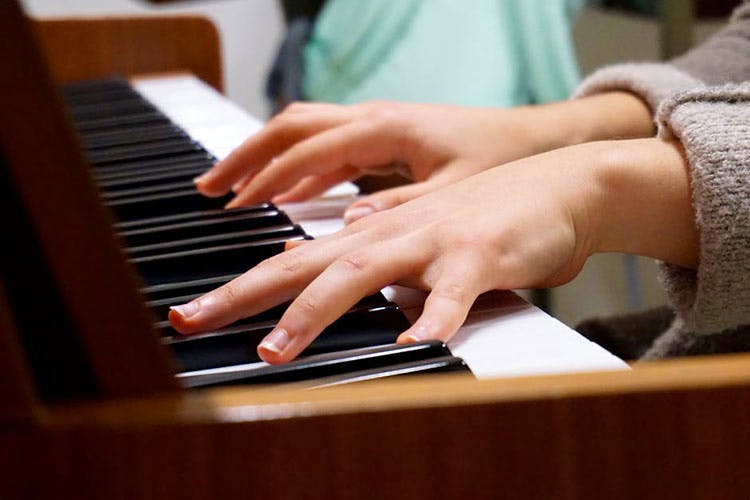 Piano,Pianist,Nail,Keyboard,Musical instrument,Hand,Finger,Electronic instrument,Technology,Electronic device