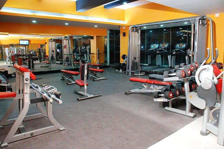 Gym,Room,Physical fitness,Sport venue,Exercise equipment,Exercise,Exercise machine,Machine,Flooring,Weight training