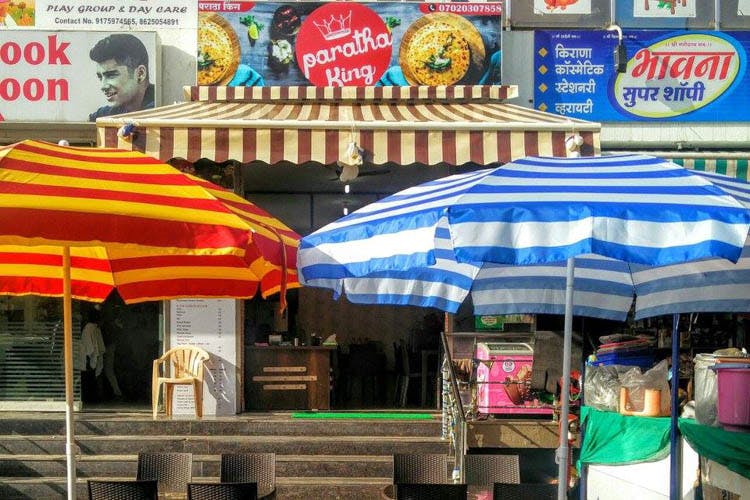 Awning,Umbrella,Building,Fashion accessory,Stall,Shade