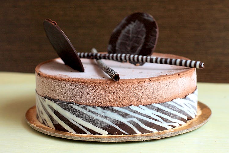 Offers & Deals on Belgian Chocolate Ice Cream Cake - 525 Gms in Janakpuri,  New Delhi - magicpin | October, 2023