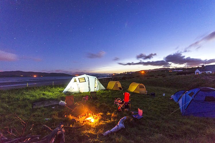 Tent,Camping,Sky,Campfire,Night,Ecoregion,Geological phenomenon,Camp,Landscape,Grassland