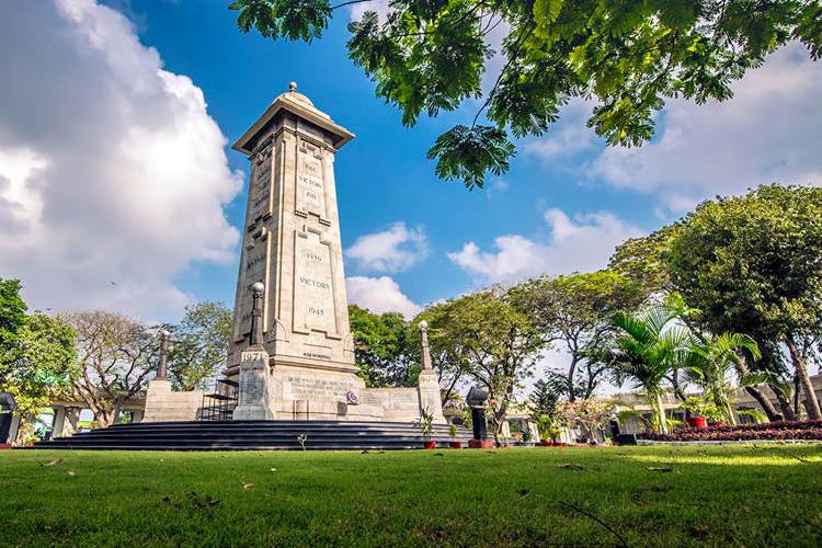 Landmark,Sky,Tree,Monument,Architecture,Cloud,Building,Historic site,Grass,City