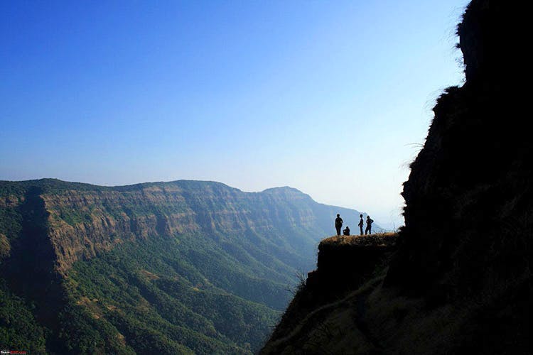 Sky,Mountainous landforms,Mountain,Hill station,Cliff,Terrain,Hill,Valley,Cloud,Rock