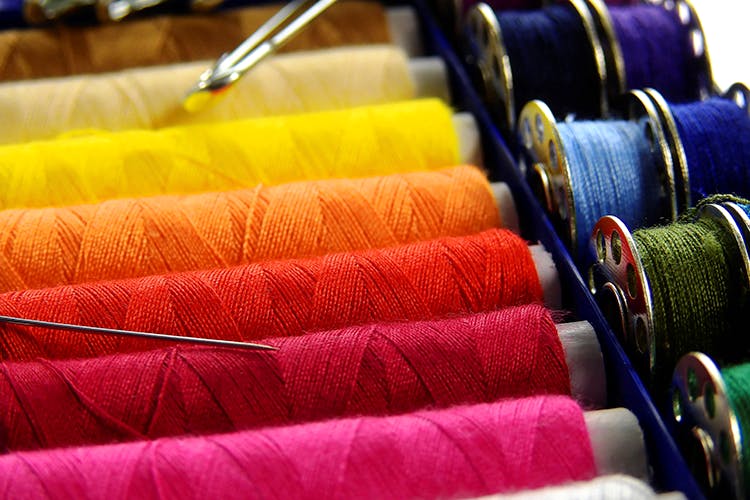 Sewing,Product,Thread,Textile,Spinning,Sewing machine,Fashion accessory,Magenta,Woven fabric,Craft