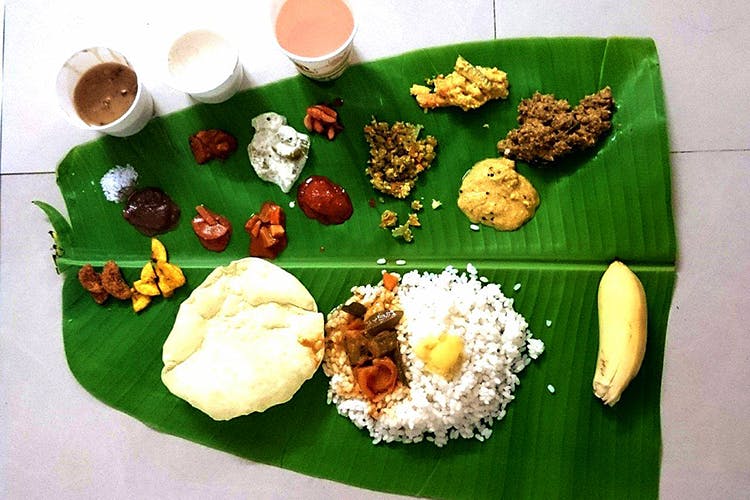 Dish,Food,Cuisine,Sadya,Banana leaf rice,Banana leaf,Ingredient,Steamed rice,Andhra food,Rice