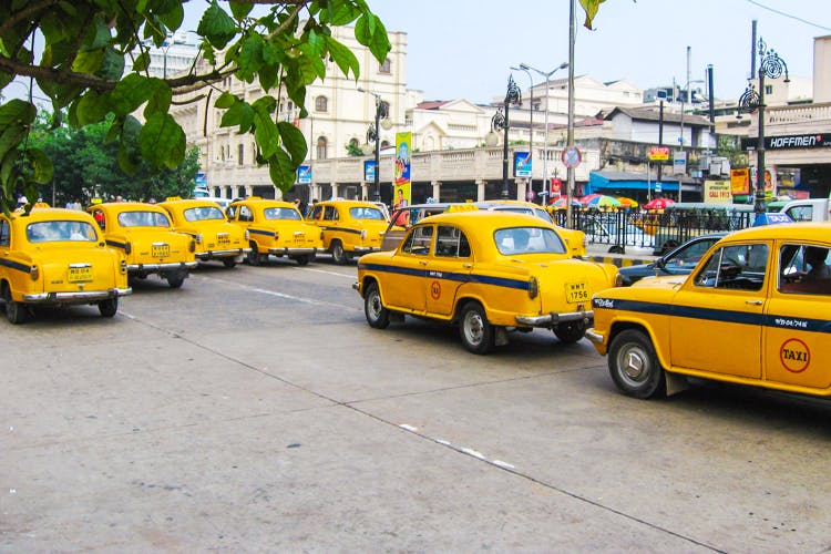 Land vehicle,Vehicle,Car,Motor vehicle,Taxi,Yellow,Mode of transport,Transport,Classic car,Traffic