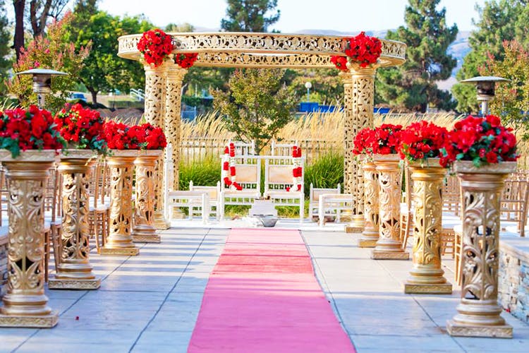 Decoration,Arch,Aisle,Yellow,Ceremony,Flower,Architecture,Floral design,Wedding reception,Flower Arranging