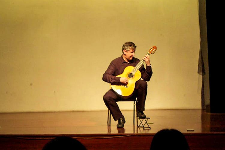 String instrument,Musical instrument,String instrument,Guitar,Plucked string instruments,Performance,Musician,Talent show,Music,Acoustic guitar