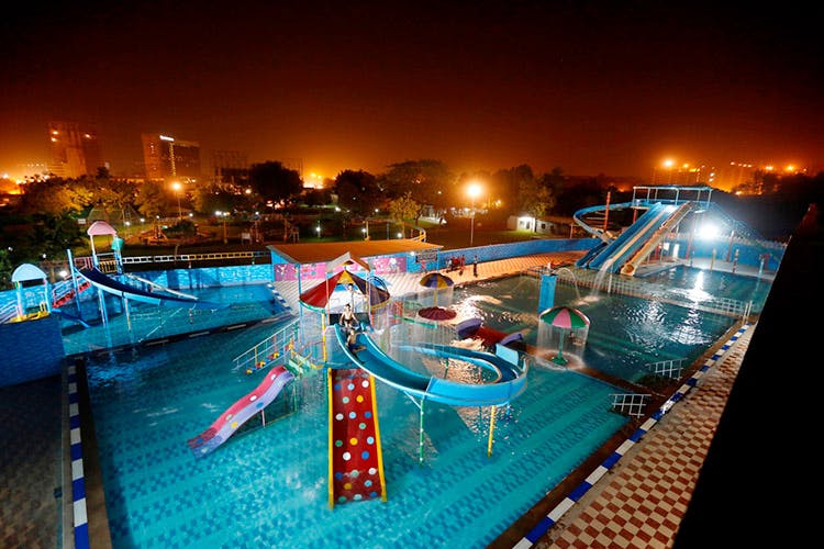 Swimming pool,Leisure,Fun,Recreation,Leisure centre,Amusement park,Night,Vacation,Nonbuilding structure,Resort