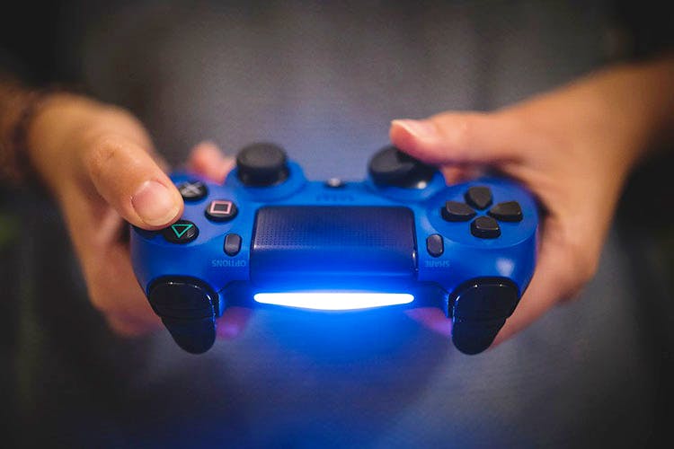 Game controller,Input device,Playstation accessory,Home game console accessory,Electronic device,Technology,Gadget,Video game accessory,Joystick,Electric blue