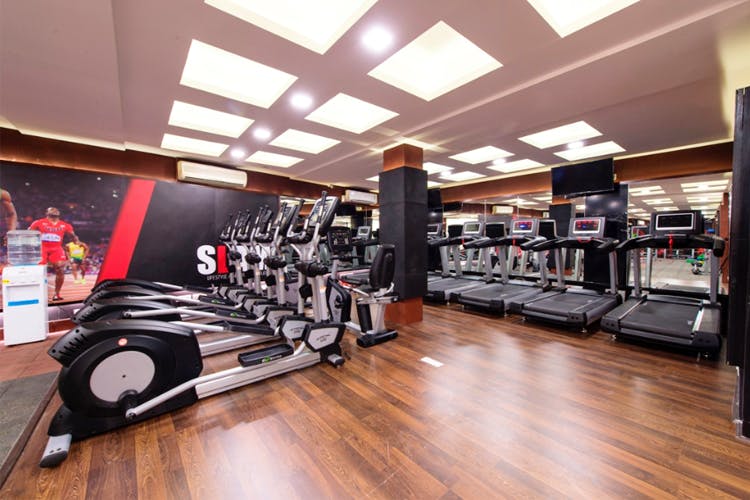 Gym,Sport venue,Room,Floor,Physical fitness,Flooring,Treadmill,Exercise machine,Building,Exercise equipment