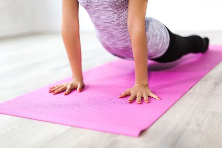 Physical fitness,Yoga mat,Pink,Floor,Mat,Mat,Arm,Leg,Yoga,Flooring