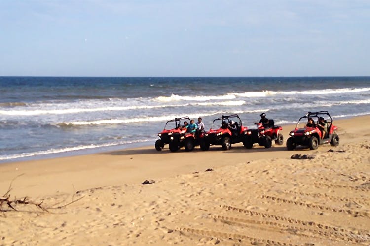 Sand,Beach,Natural environment,Shore,Vehicle,Sea,Vacation,Coast,Ocean,Fun