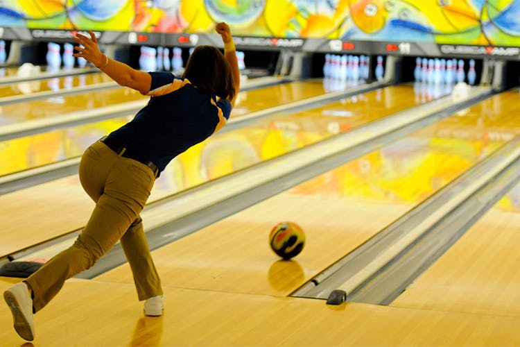 Bowling,Ten-pin bowling,Bowling pin,Bowling equipment,Bowler,Ball,Yellow,Bowling ball,Fun,Individual sports