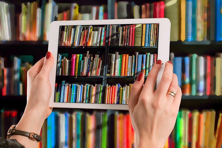 Shelving,Bookcase,Shelf,Library,Book,Public library,Publication,Furniture,Hand,Self-help book