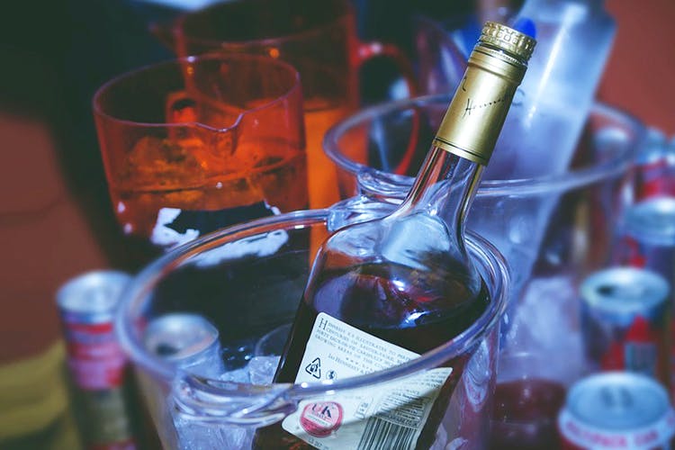 Alcohol,Drink,Liqueur,Bottle,Distilled beverage,Alcoholic beverage,Glass bottle,Glass,Fluid