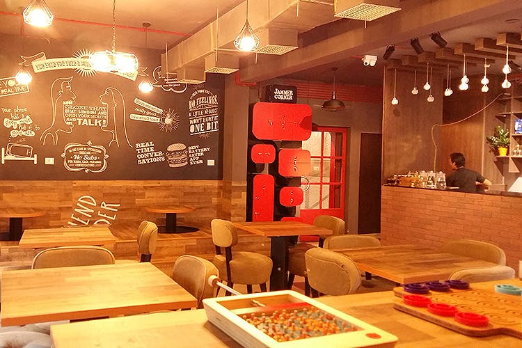 Interior design,Restaurant,Room,Lighting,Building,Table,Ceiling,Furniture,Fast food restaurant,Light fixture