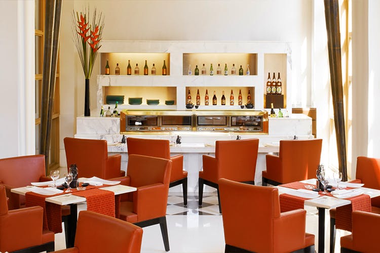 Furniture,Orange,Room,Building,Interior design,Restaurant,Table,Dining room,Café,Organization