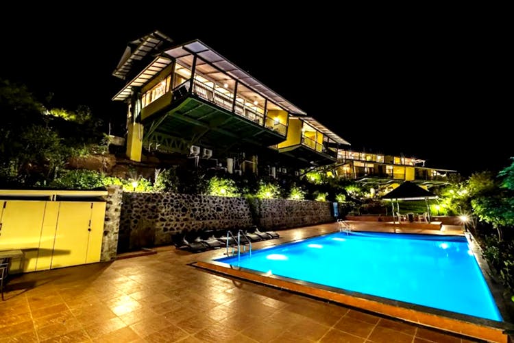 Swimming pool,Property,Lighting,Architecture,Building,Home,House,Night,Resort,Leisure