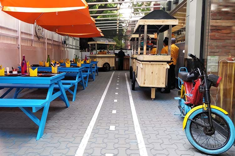 Transport,Vehicle,Bicycle,Building,Leisure,Sidewalk,Flooring,Restaurant