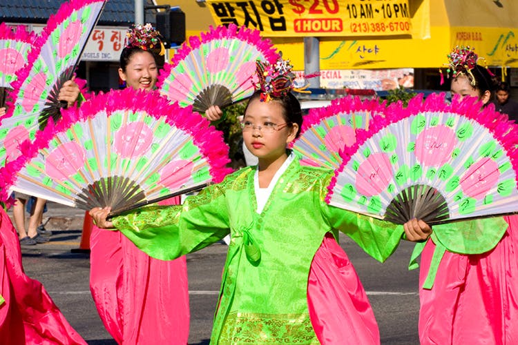 Pink,Hand fan,Umbrella,Event,Fashion accessory,Festival