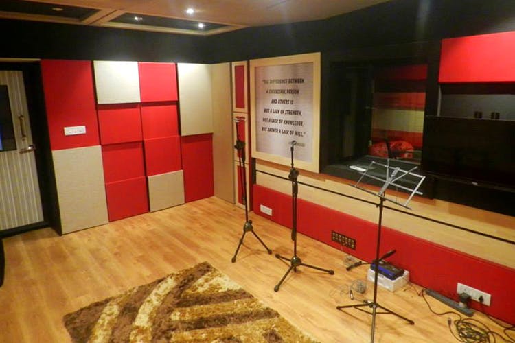 Recording studio,Building,Room,Property,Interior design,Studio,Floor,Architecture,Stage,Flooring