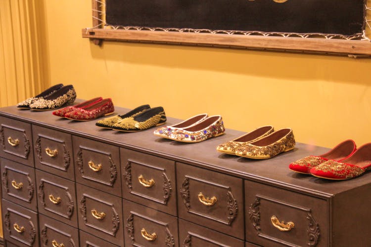 Footwear,Chest of drawers,Shoe,Room,Shoe store,Furniture,Drawer,Collection,Closet