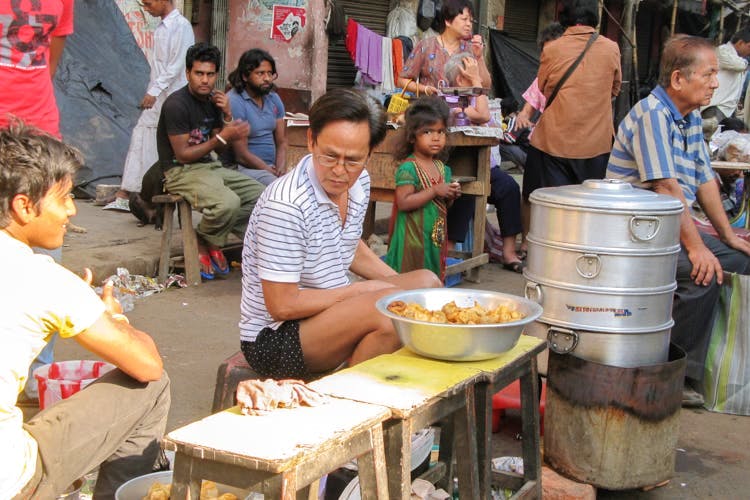 Street food,Child,Hawker,Meal,Food,Cuisine,Market,Chinese food,Lunch,Street