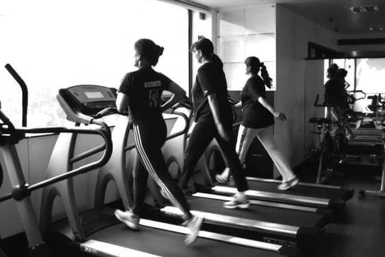 Treadmill,Gym,Exercise machine,Exercise equipment,Sport venue,Physical fitness,Room,Standing,Sports equipment,Leisure