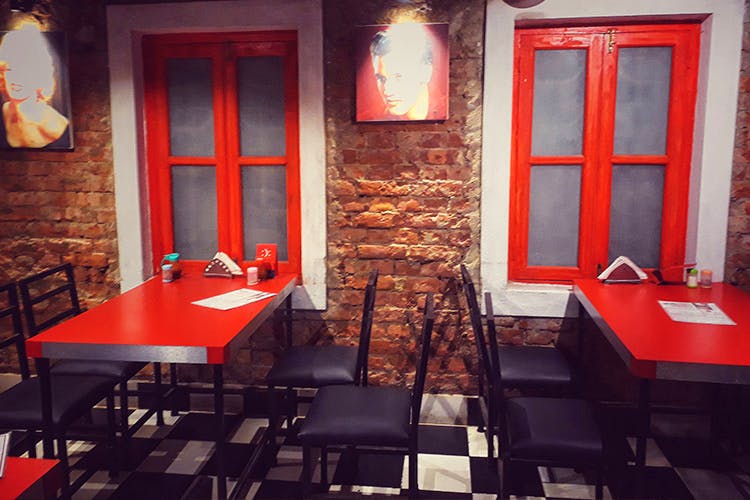 Red,Room,Interior design,Table,Building,Furniture,Restaurant,Chair,Architecture,Door