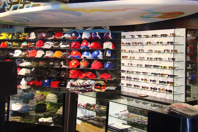 Product,Outlet store,Retail,Building,Footwear,Display case,Helmet,Collection,Athletic shoe,Skate shoe