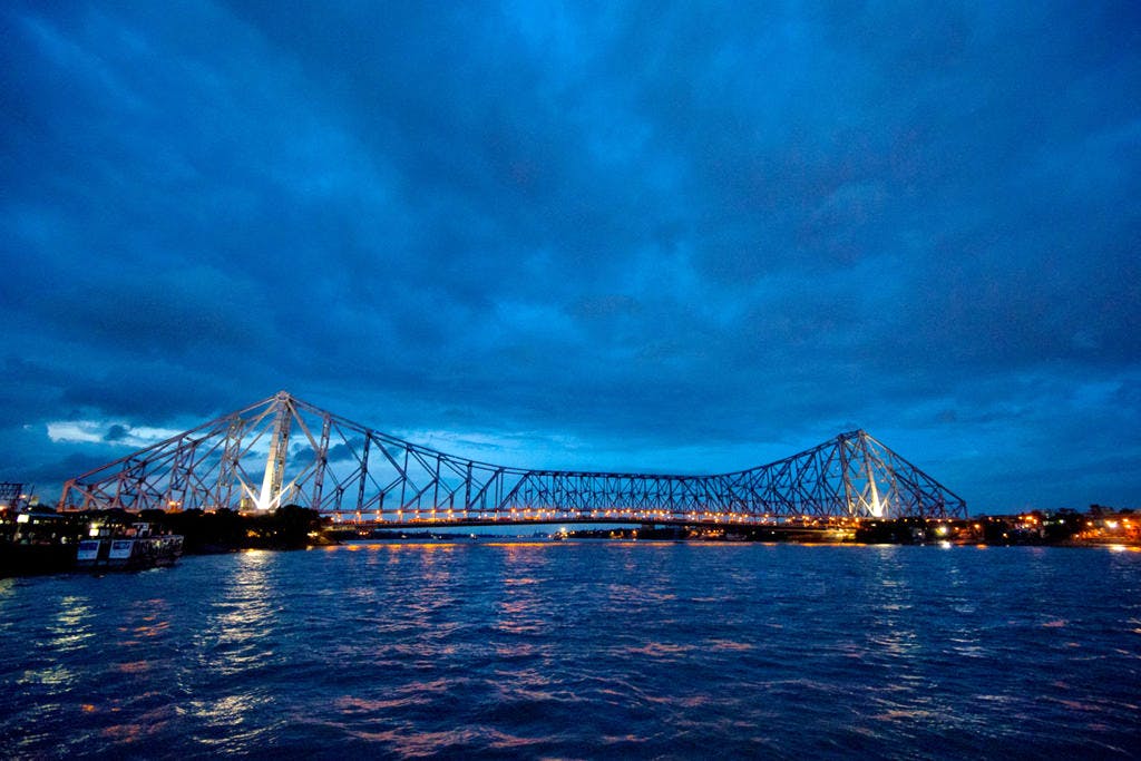 Bridge,Sky,Cable-stayed bridge,Blue,Night,Suspension bridge,Water,Landmark,Cloud,Dusk