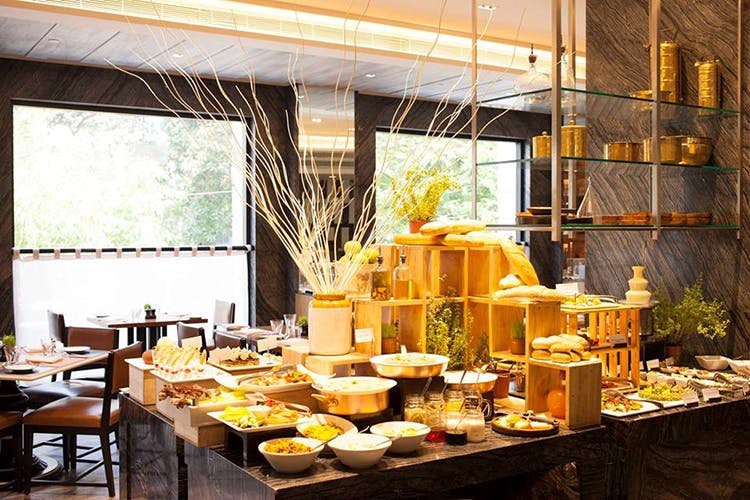 Yellow,Brunch,Meal,Interior design,Buffet,Table,Room,Restaurant,Design,Building