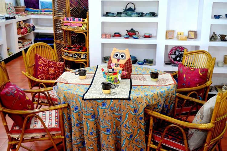 Room,Interior design,Textile,Furniture,Table,Toy,Art,House,Home,Visual arts