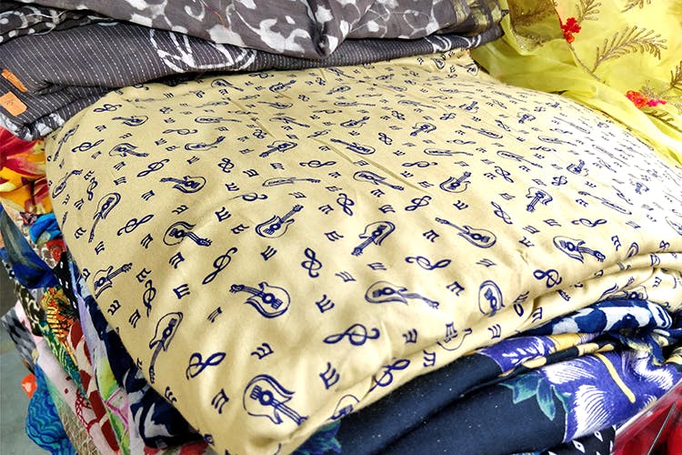 Yellow,Textile,Bed sheet,Bedding,Furniture,Linens,Pillow,Cushion,Room,Quilting