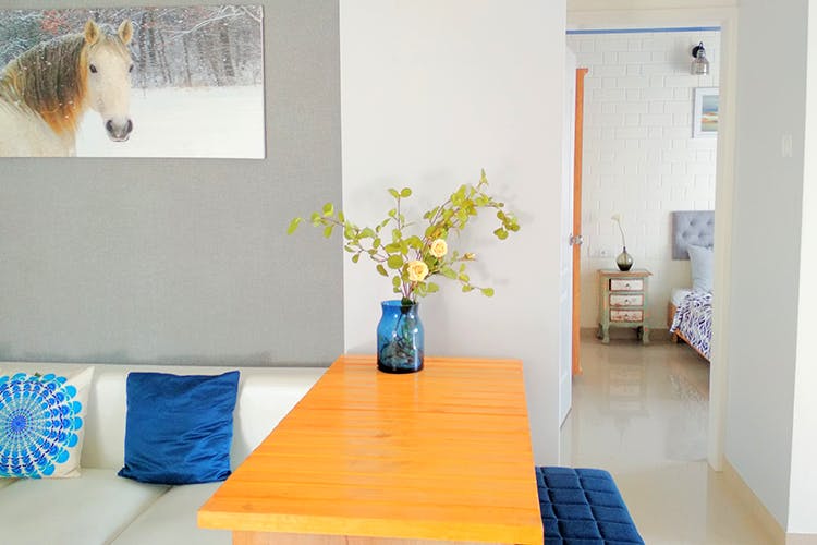Room,Blue,Interior design,Property,Floor,Furniture,Table,Yellow,Orange,Wall