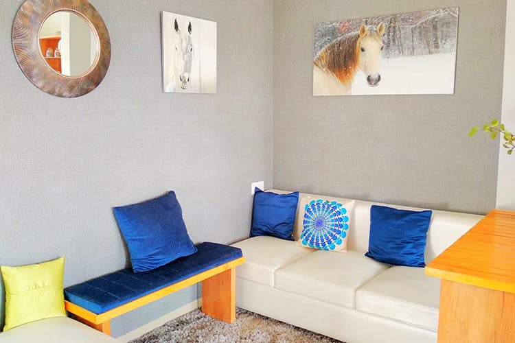 Room,Furniture,Couch,Property,Living room,Blue,Interior design,Orange,studio couch,House